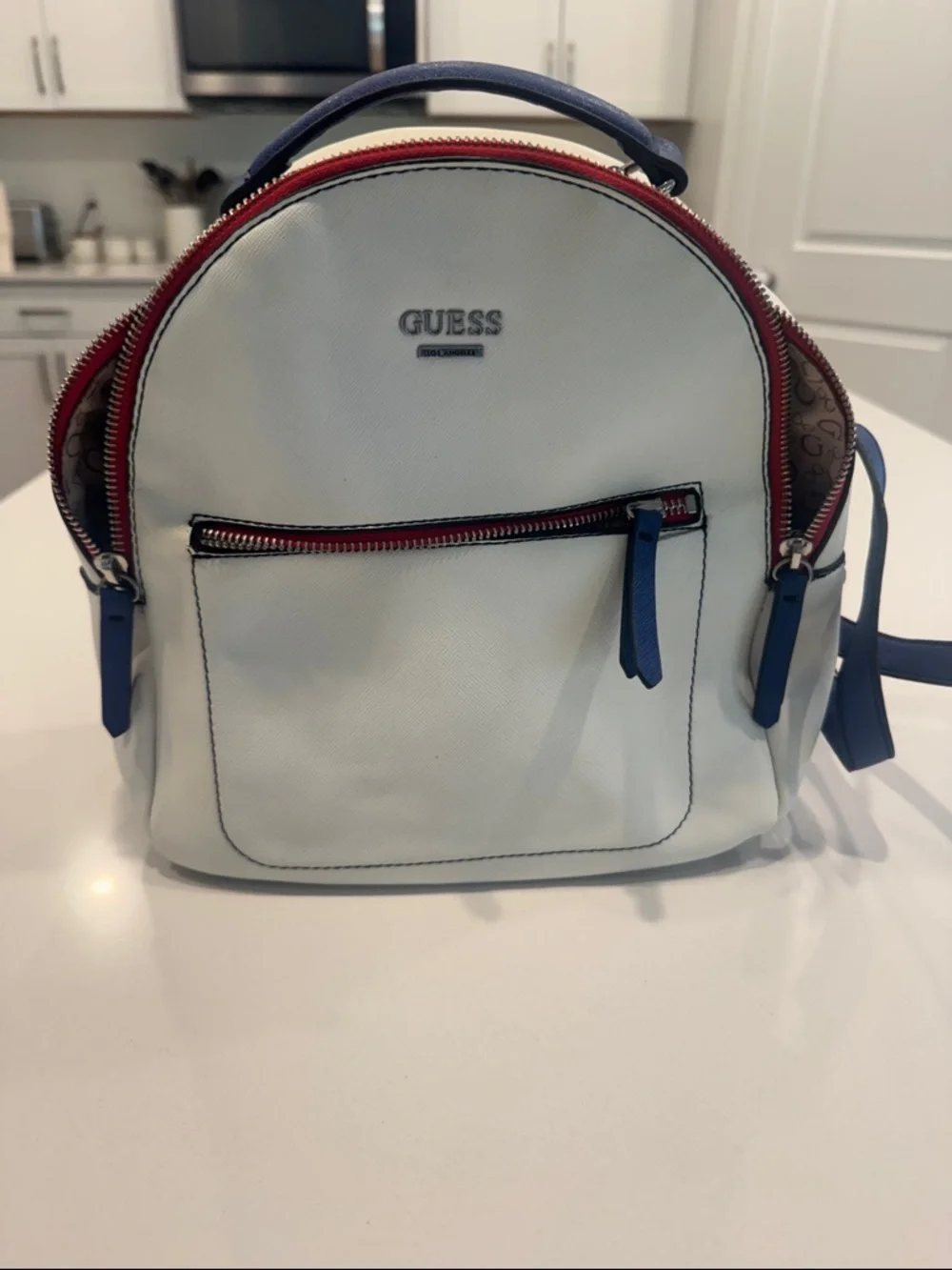 GUESS White Backpack with Blue Trim and Red Zippers